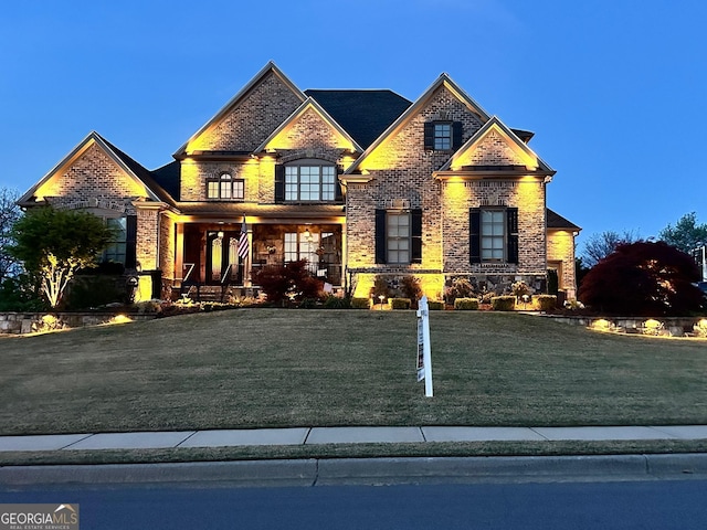 968 Woodtrace Ln, Auburn, GA 30011 - craftsman-style home with a front yard, brick siding, and a porch