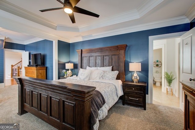 tiled bedroom with ensuite bathroom, carpet floors, crown molding, and a ceiling fan
