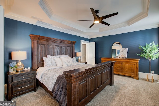 bedroom with light colored carpet, visible vents, crown molding, and a raised ceiling