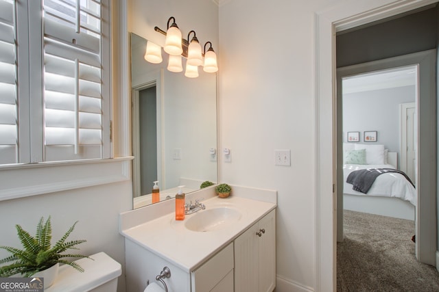 bathroom featuring toilet and vanity