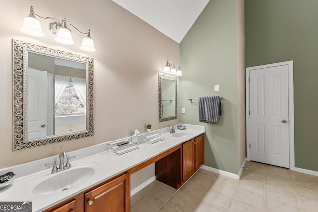 79 Tiffany Trce, Palmetto, GA 30268 - bathroom with baseboards, lofted ceiling, a sink, and double vanity
