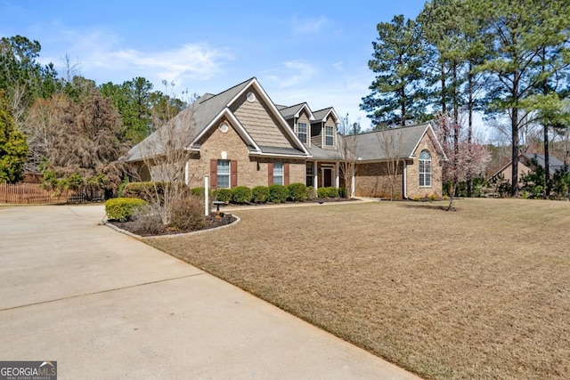 79 Tiffany Trce, Palmetto, GA 30268 - view of front of property with a front yard, brick siding, and concrete driveway