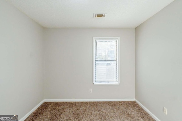 870 Chapman Cir, Stone Mountain, GA 30088 - carpeted spare room featuring baseboards