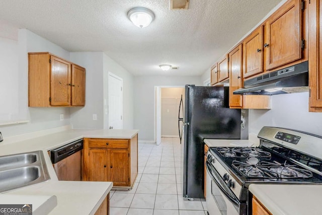 870 Chapman Cir, Stone Mountain, GA 30088 - kitchen with appliances with stainless steel finishes, under cabinet range hood, light countertops, a peninsula, and a textured ceiling