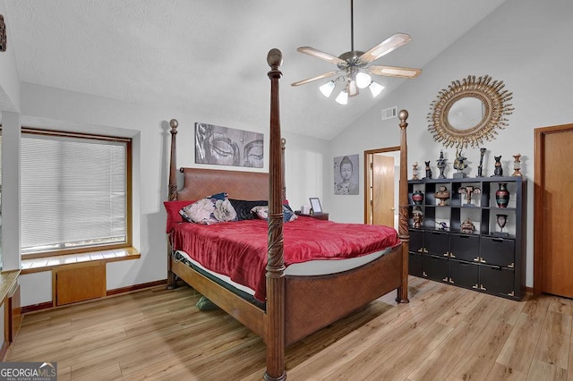 bedroom with lofted ceiling, baseboards, visible vents, and light wood-type flooring