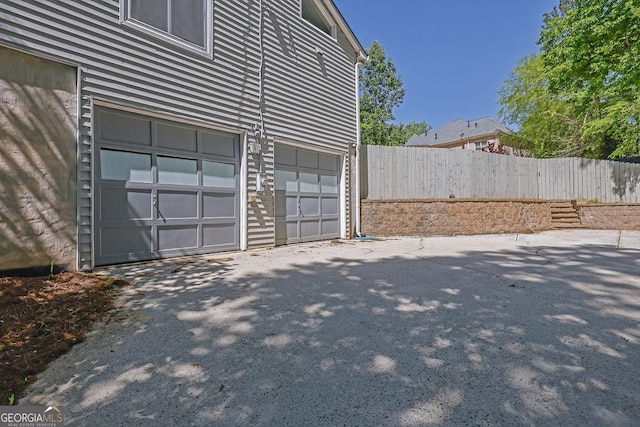 garage with fence