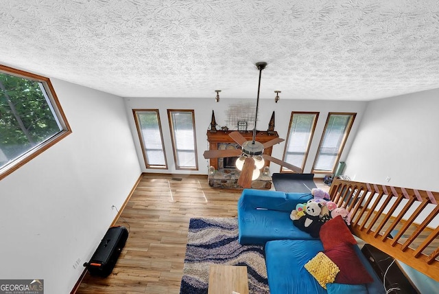 living room featuring wood finished floors and a healthy amount of sunlight