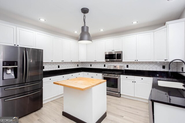 4215 Steeplehill Dr NW, Kennesaw, GA 30144 - kitchen featuring stainless steel appliances, wooden counters, white cabinets, light wood-style flooring, and recessed lighting