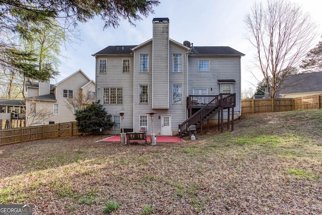 4215 Steeplehill Dr NW, Kennesaw, GA 30144 - rear view of house with stairway, a fenced backyard, a patio, and a chimney