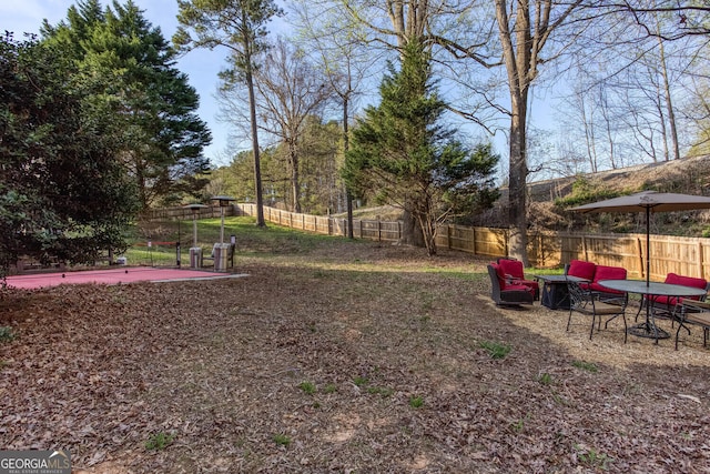 4215 Steeplehill Dr NW, Kennesaw, GA 30144 - fenced backyard with a patio area