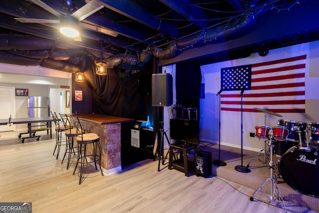 4215 Steeplehill Dr NW, Kennesaw, GA 30144 - indoor dry bar with wood finished floors and freestanding refrigerator