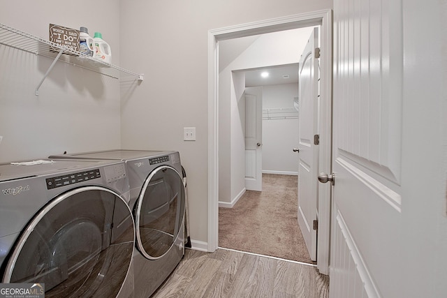 32 October Ave, Newnan, GA 30265 - washroom featuring independent washer and dryer, baseboards, and light wood-style flooring