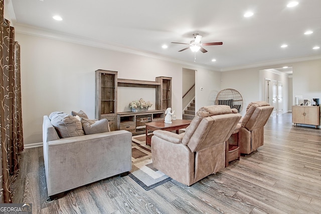 32 October Ave, Newnan, GA 30265 - living area featuring stairway, light wood-style flooring, ceiling fan, recessed lighting, and crown molding