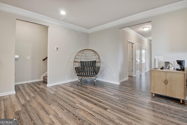 32 October Ave, Newnan, GA 30265 - unfurnished living room with wood finished floors, crown molding, baseboards, and stairs
