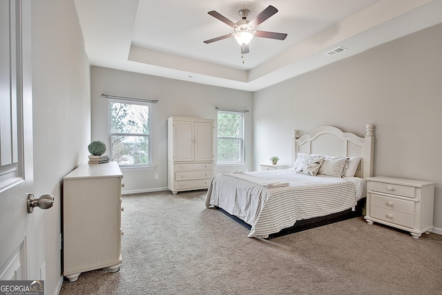 32 October Ave, Newnan, GA 30265 - bedroom featuring light carpet, baseboards, a raised ceiling, and ceiling fan