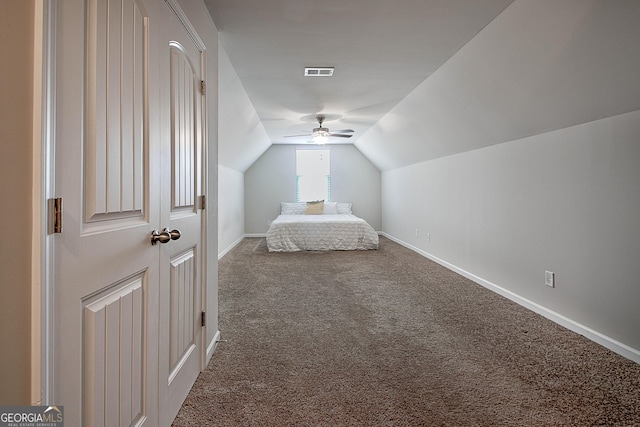 32 October Ave, Newnan, GA 30265 - unfurnished bedroom featuring carpet, lofted ceiling, baseboards, and a ceiling fan