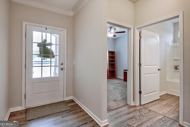 32 October Ave, Newnan, GA 30265 - entryway featuring wood finished floors, ornamental molding, baseboards, and ceiling fan