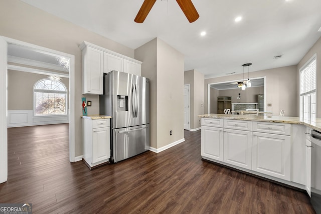 kitchen with white cabinetry, ceiling fan, a healthy amount of sunlight, and appliances with stainless steel finishes