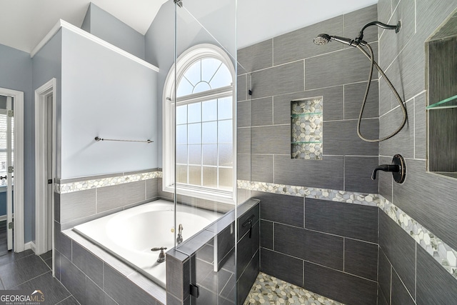 full bathroom featuring a walk in shower, a bath, and tile patterned flooring