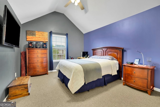 bedroom with carpet, baseboards, vaulted ceiling, and ceiling fan