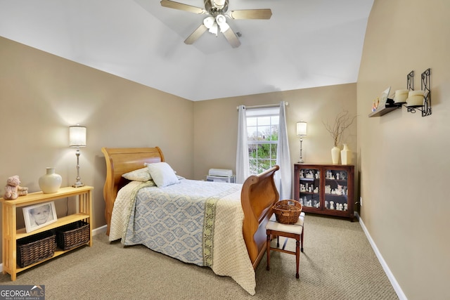 bedroom with carpet flooring, baseboards, a ceiling fan, and lofted ceiling