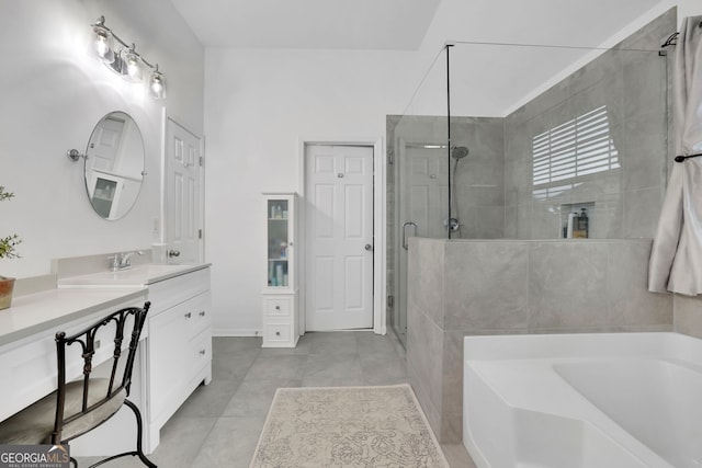 full bathroom featuring a shower stall, tile patterned flooring, vanity, and a garden tub