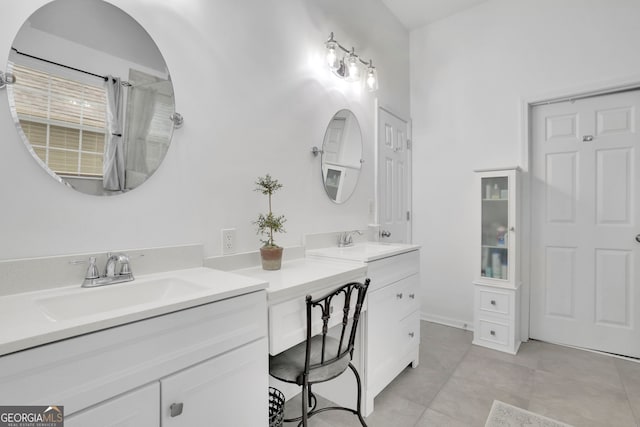 bathroom featuring tile patterned flooring and vanity