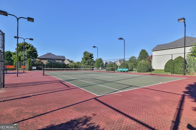 view of sport court featuring community basketball court and fence