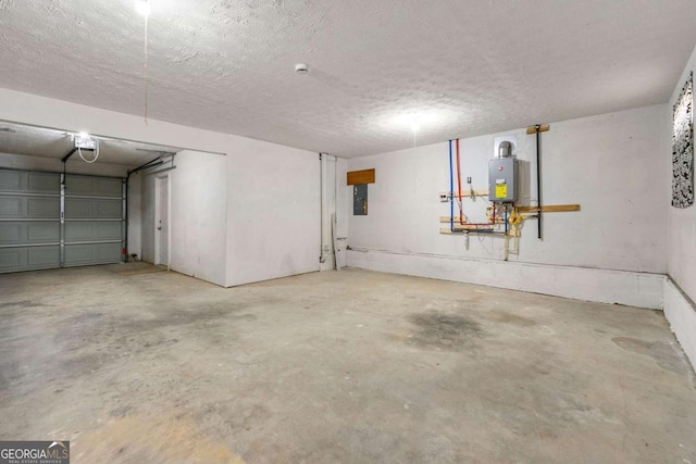 garage with water heater and a garage door opener