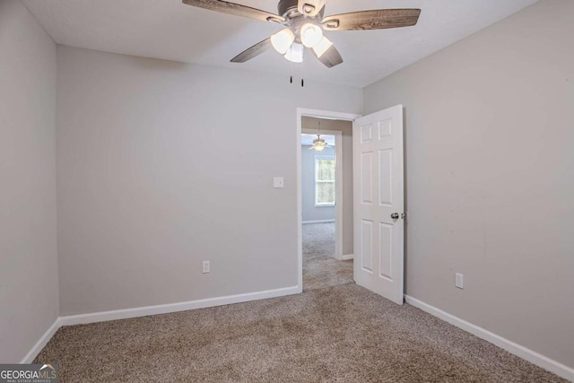 477 Victoria Rd, Woodstock, GA 30189 - carpeted empty room with ceiling fan