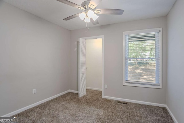 477 Victoria Rd, Woodstock, GA 30189 - unfurnished bedroom with carpet and ceiling fan