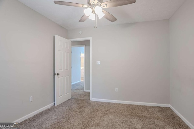 477 Victoria Rd, Woodstock, GA 30189 - carpeted empty room with a ceiling fan and baseboards