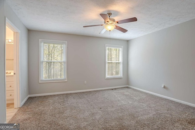 477 Victoria Rd, Woodstock, GA 30189 - empty room featuring a textured ceiling, a ceiling fan, and light carpet