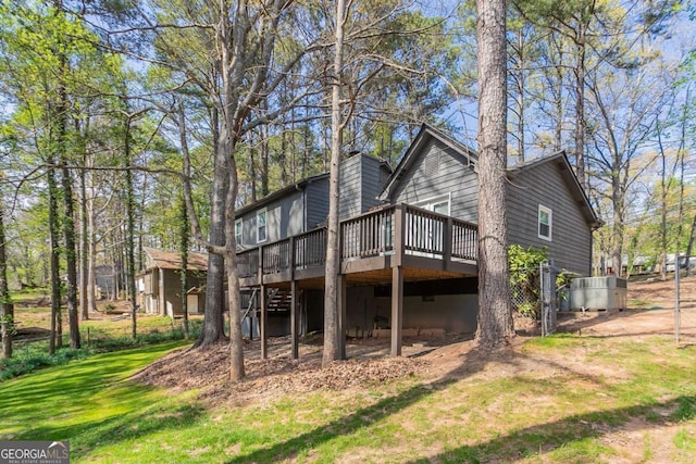 477 Victoria Rd, Woodstock, GA 30189 - back of house with a wooden deck and a yard