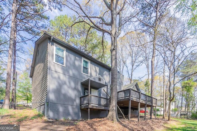 477 Victoria Rd, Woodstock, GA 30189 - rear view of house featuring a deck