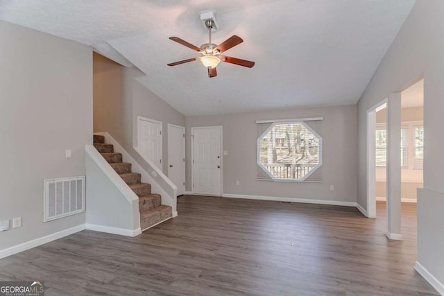 477 Victoria Rd, Woodstock, GA 30189 - foyer with lofted ceiling, a ceiling fan, wood finished floors, and stairway