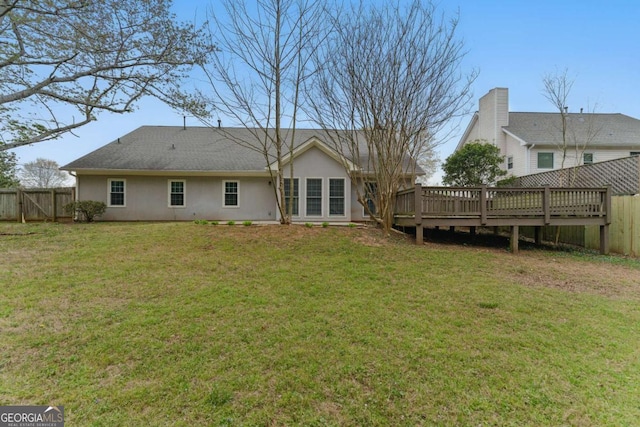 11925 N Hickory Trce, Alpharetta, GA 30004 - back of property with a fenced backyard, stucco siding, a yard, and a wooden deck
