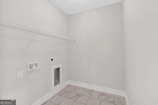 4444 Sullivan Rd, Powder Springs, GA 30127 - laundry room featuring hookup for a washing machine, baseboards, marble finish floor, laundry area, and hookup for an electric dryer