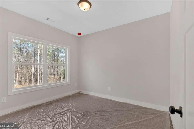 4444 Sullivan Rd, Powder Springs, GA 30127 - carpeted empty room featuring baseboards