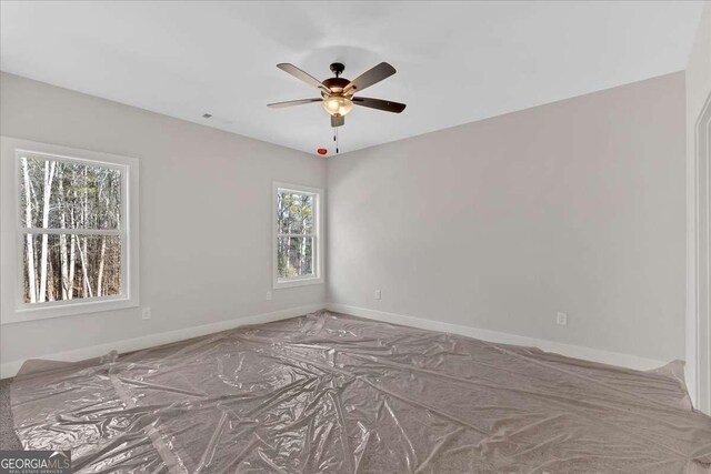 4444 Sullivan Rd, Powder Springs, GA 30127 - empty room with baseboards and a ceiling fan