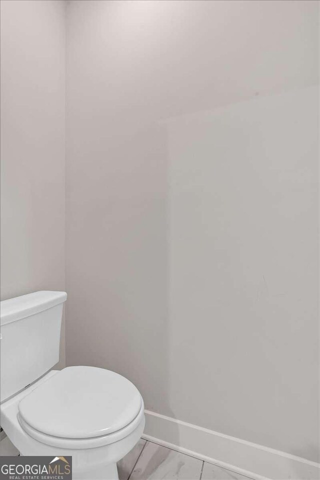 4444 Sullivan Rd, Powder Springs, GA 30127 - bathroom with baseboards and toilet