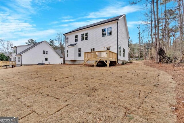 4444 Sullivan Rd, Powder Springs, GA 30127 - back of property with cooling unit and a wooden deck