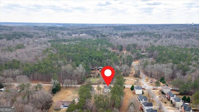 4444 Sullivan Rd, Powder Springs, GA 30127 - drone / aerial view featuring a wooded view