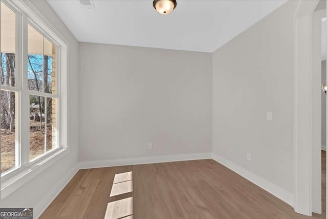 4444 Sullivan Rd, Powder Springs, GA 30127 - empty room with baseboards and wood finished floors