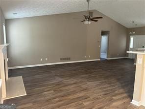 unfurnished living room with vaulted ceiling, a ceiling fan, baseboards, visible vents, and dark wood-type flooring