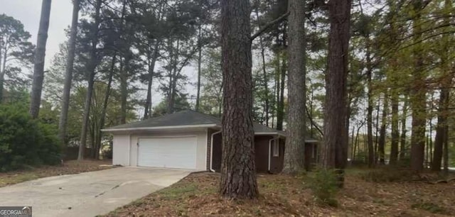 3488 Richmond Dr SE, Conyers, GA 30094 - ranch-style home with concrete driveway and an attached garage