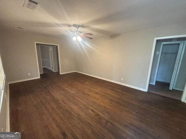 3488 Richmond Dr SE, Conyers, GA 30094 - spare room featuring dark wood-type flooring and ceiling fan