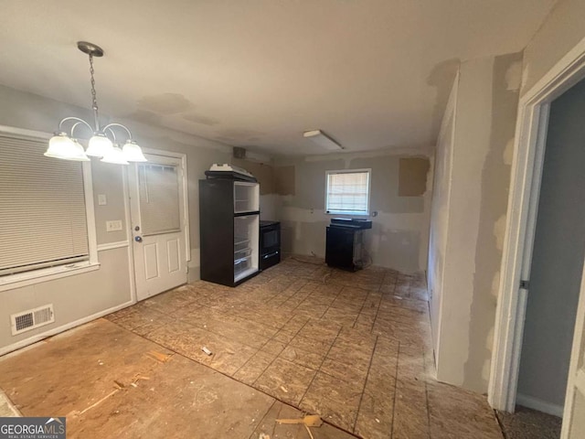 3488 Richmond Dr SE, Conyers, GA 30094 - kitchen featuring a chandelier and hanging light fixtures