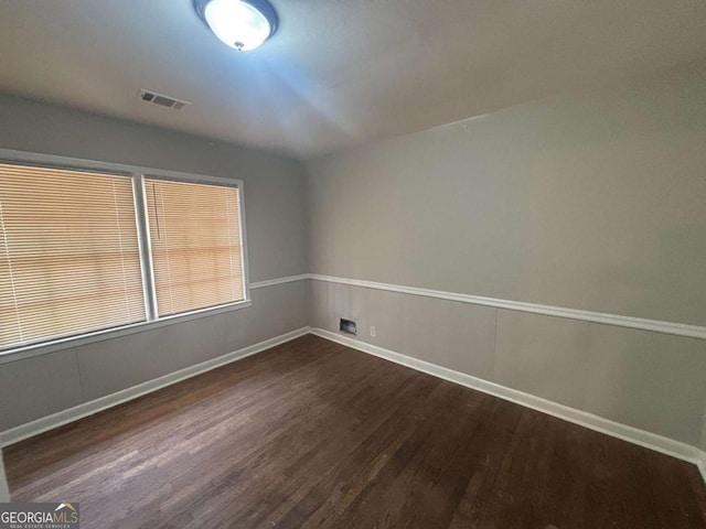 3488 Richmond Dr SE, Conyers, GA 30094 - empty room with dark wood-type flooring and baseboards