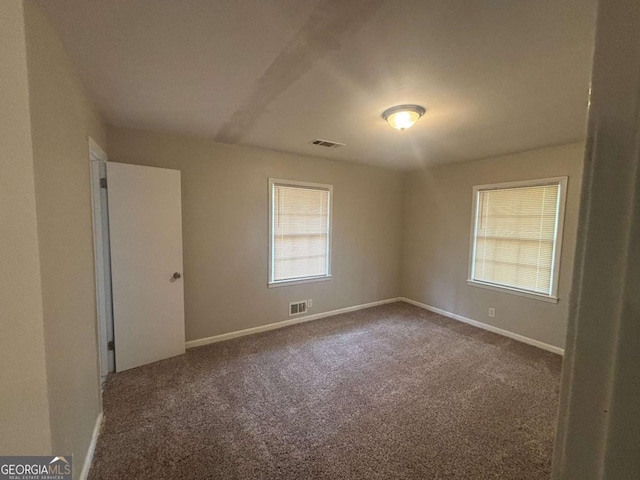 3488 Richmond Dr SE, Conyers, GA 30094 - carpeted empty room with healthy amount of natural light